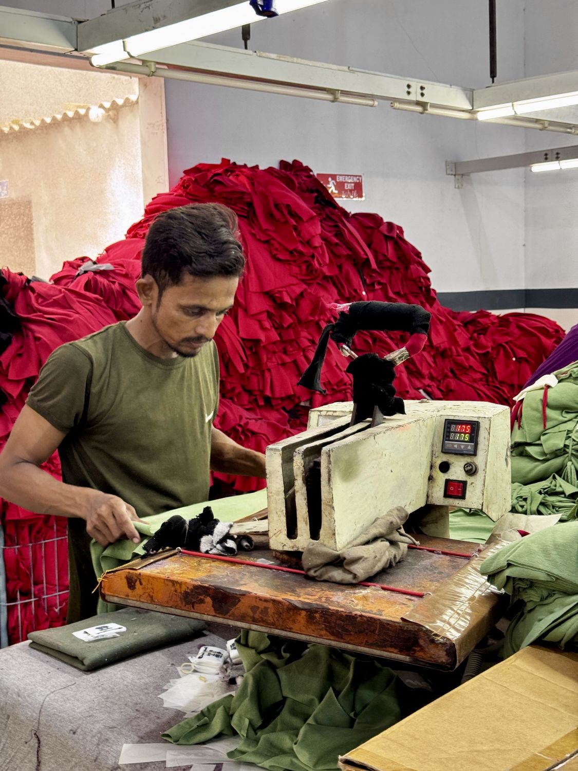 Heat press station — inside the Knitora facility