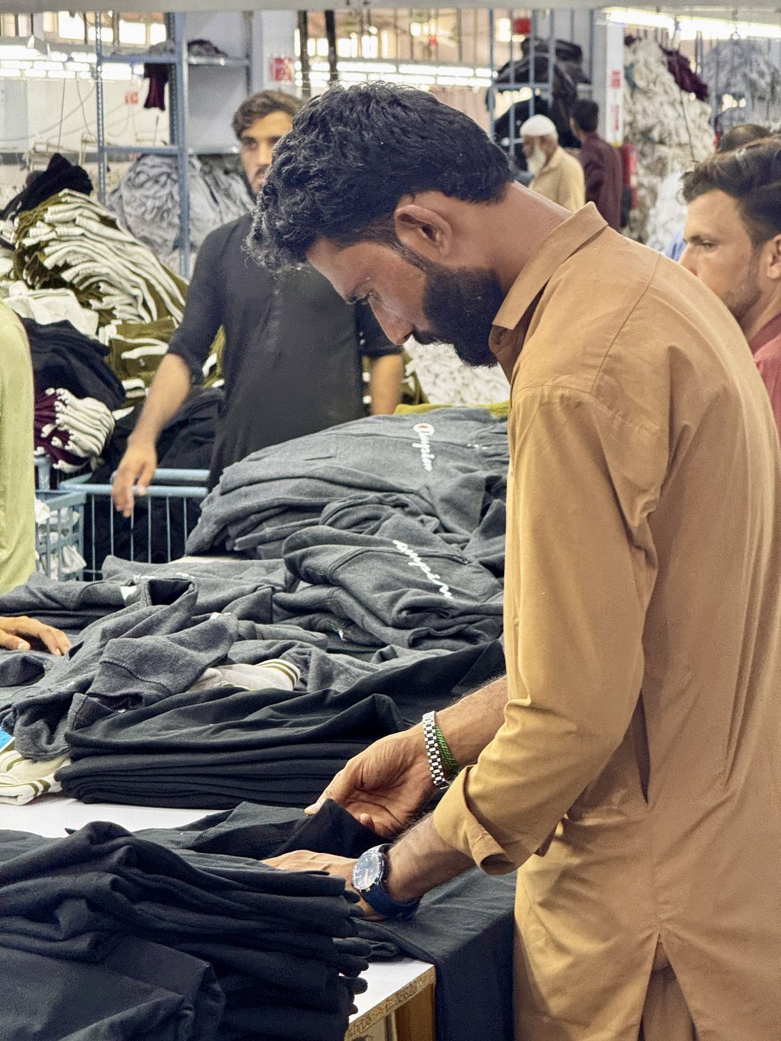 Garment folding & sorting — inside the Knitora facility